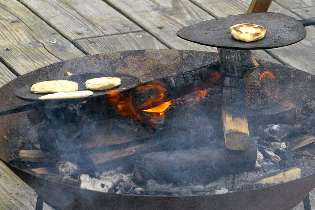 Picture of birka bread being cooked over fire.